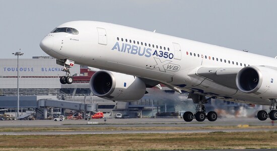 FILE PHOTO: An Airbus A350 takes off at the aircraft builder's headquarters in Colomiers near Toulouse