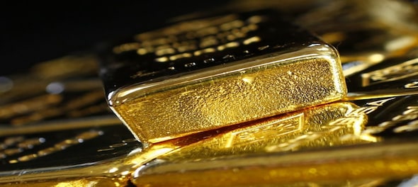 Gold prices jump amid choppy trade as dollar falls