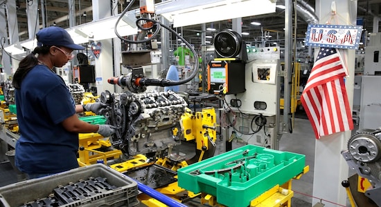 A General Motors assembly worker works on assembling a V6 engine, used in a variety of GM cars, trucks and crossovers, at the GM Romulus Powertrain plant in Romulus, Michigan, U.S. August 21, 2019. Picture taken August 21, 2019. Rebecca Cook