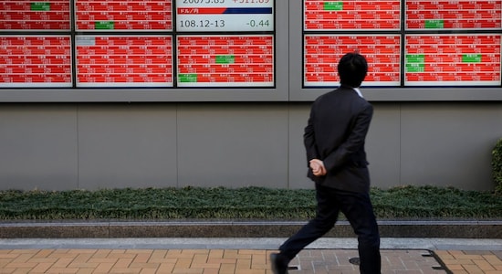 Asian shares firm, dollar bruised as Fed hike dashes more hawkish bets