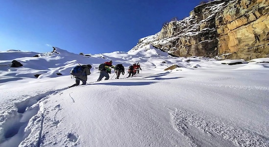 **EDS: BEST QUALITY AVAILABLE** Lahaul-Spiti: Locals are assisted by experts in mountain travel to trek across the snow-clad range in Rohtang Pass area following heavy snowfall, in Lahaul Spiti of Himachal Pradesh, Tuesday, Nov. 26, 2019. (PTI Photo)(PTI11_26_2019_000173B)