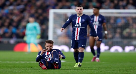 PSG's Neymar, left, grimaces in pain after a tackle during a Champions League soccer match Group A between Real Madrid and Paris Saint Germain at the Santiago Bernabeu stadium in Madrid, Spain, Tuesday, Nov. 26, 2019. (AP Photo/Manu Fernandez)