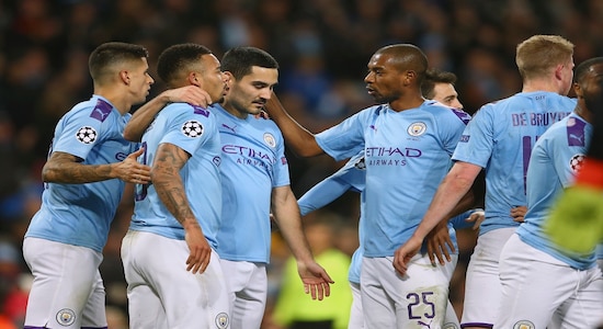 Manchester City players celebrate with Ilkay Gundogan, center, after he scored his side's first goal during the group C Champions League soccer match between Manchester City and Shakhtar Donetsk at the Etihad Stadium in Manchester, England, Tuesday, Nov. 26, 2019. (AP Photo/Dave Thompson)
