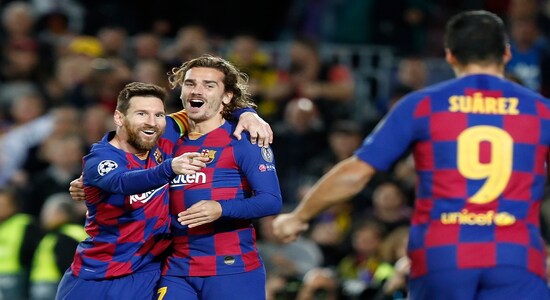 Barcelona's Lionel Messi, left, celebrates after scoring his side's second goal with Antoine Griezmann, centre and Luis Suarez during a Champions League soccer match Group F between Barcelona and Dortmund at the Camp Nou stadium in Barcelona, Spain, Wednesday, Nov. 27, 2019. (AP Photo/Joan Monfort) Barcelona's Lionel Messi, left, celebrates after scoring his side's second goal with Antoine Griezmann, centre and Luis Suarez during a Champions League soccer match Group F between Barcelona and Dortmund at the Camp Nou stadium in Barcelona, Spain, Wednesday, Nov. 27, 2019. (AP Photo/Joan Monfort)
