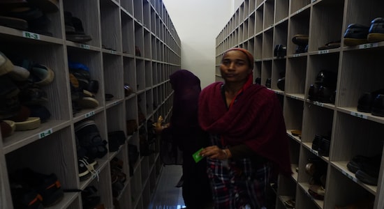 Inside the shoe cabins where devotees work as caretakers