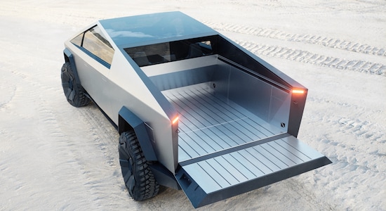 With up to 3,500 pounds of payload capacity and adjustable air suspension, Cybertruck is the most powerful tool we have ever built, engineered with 100 cubic feet of exterior, lockable storage — including a magic tonneau cover that is strong enough to stand on.