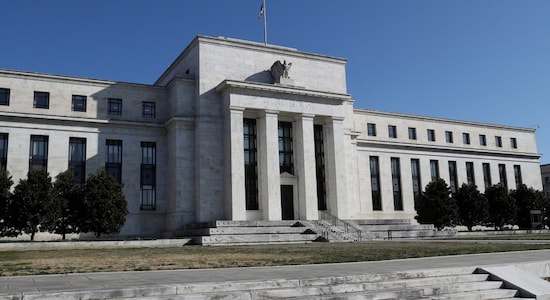 Fed sees higher growth, above target inflation this year, rates remain steady