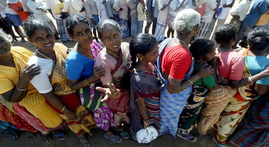 FILE PHOTO: Indian tsunami survivors stand in a queue to receive relief provisions in Cuddalore, south of the Indian city of Madras, December 31, 2004. REUTERS/Arko Datta