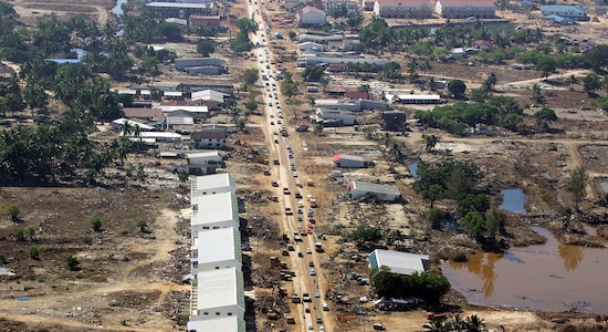 FILE PHOTO: An aerial view of Khao Lak, north of the Thai island of Phuket, December 30, 2004 following the deadly tsunami. REUTERS/Luis Enrique Ascui