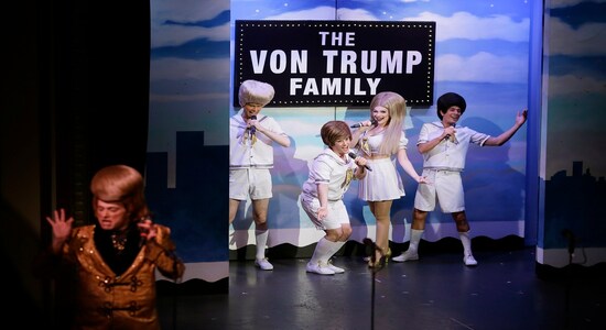 In this Wednesday, Dec. 4, 2019 photo, characters portraying the Trump family and President Donald Trump perform during the musical &quot;Beach Blanket Babylon&quot; in San Francisco. The campy small San Francisco show that's been a must-see for tourists and locals alike for more than 45 years is closing its curtain. The show, which spoofs politics and pop culture, started in 1974, making it the nation's longest continuously running musical revue. Its final performance is set for New Year’s Eve. (AP Photo/Eric Risberg)
