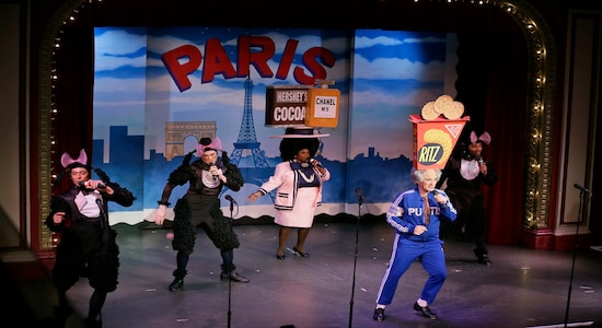 In this Wednesday, Dec. 4, 2019 photo, characters portraying French poodles, Coco Chanel and Vladimir Putin perform during the musical &quot;Beach Blanket Babylon&quot; in San Francisco. The campy small San Francisco show that's been a must-see for tourists and locals alike for more than 45 years, making it the nation's longest continuously running musical revue, is closing its curtain. Its final performance is set for New Year’s Eve. (AP Photo/Eric Risberg)