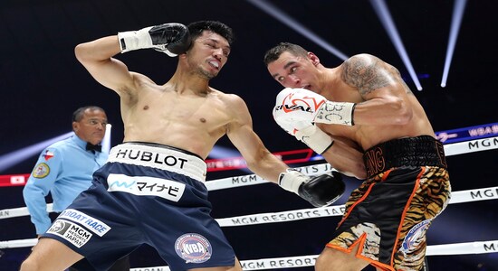 In this Monday, Dec. 23, 2019, file photo, Japanese champion Ryota Murata, left, sends a left hook to Canadian challenger Steve Butler in the second round of their WBA middleweight world boxing title match in Yokohama, southwest of Tokyo. Murata defended his title by a technical knockout in the fifth round. (AP Photo/Toru Takahashi, File)