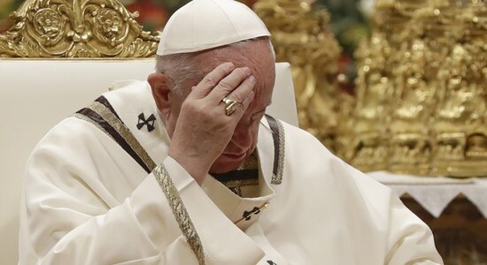 Pope Francis says sorry for losing patience with hand-shaker who yanked him