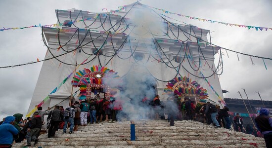 Locals launch fireworks from the steps of Saint Thomas church during celebration honoring the patron saint of Chichicastenango, Guatemala, Saturday, Dec. 21, 2019. The church is built atop a former sacred Maya site and incorporates the temple's 18 steps, each representing a month of the Mayan calendar. (AP Photo/Moises Castillo) Locals launch fireworks from the steps of Saint Thomas church during celebration honoring the patron saint of Chichicastenango, Guatemala, Saturday, Dec. 21, 2019. The church is built atop a former sacred Maya site and incorporates the temple's 18 steps, each representing a month of the Mayan calendar. (AP Photo/Moises Castillo)