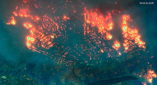 This November 2018, image provided by Maxar Technologies shows fires in Paradise, California. What happened in Paradise has become a cautionary tale about the kind of devastation that is possible when erratic winds carry sparks across a warming planet. Eighty-five people died. Some perished in cars on roads so choked by the traffic they couldn’t outrun the flames. Roughly 19,000 homes, businesses and other buildings were destroyed. (Satellite image ©2019 Maxar Technologies via AP)