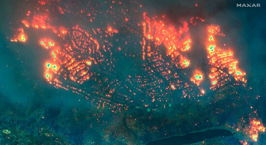 This November 2018, image provided by Maxar Technologies shows fires in Paradise, California. What happened in Paradise has become a cautionary tale about the kind of devastation that is possible when erratic winds carry sparks across a warming planet. Eighty-five people died. Some perished in cars on roads so choked by the traffic they couldn’t outrun the flames. Roughly 19,000 homes, businesses and other buildings were destroyed. (Satellite image ©2019 Maxar Technologies via AP) This November 2018, image provided by Maxar Technologies shows fires in Paradise, California. What happened in Paradise has become a cautionary tale about the kind of devastation that is possible when erratic winds carry sparks across a warming planet. Eighty-five people died. Some perished in cars on roads so choked by the traffic they couldn’t outrun the flames. Roughly 19,000 homes, businesses and other buildings were destroyed. (Satellite image ©2019 Maxar Technologies via AP)