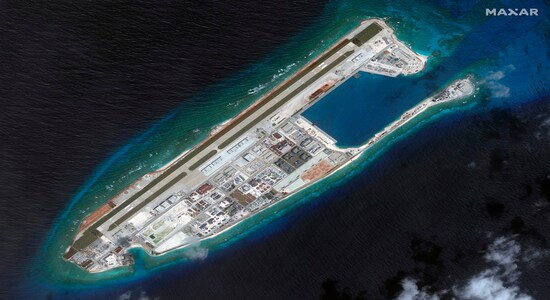 This March 2017 image shows a satellite image of Fiery Cross Reef in Spratly island chain in the South China Sea. Across the sprawling and the strategic South China Sea, nearly 70 disputed islands, reefs and atolls are occupied by five claimants. China, Taiwan, Vietnam, the Philippines and Malaysia have built airstrips, harbours, barracks and other infrastructure for both civilian and military use. Only China has created new islands by piling sand and concrete atop coral reefs. That has upset the balance of power in the region, strengthening China’s claim to the entire waterway. It also has further harmed the fragile environment already threatened by overfishing, pollution and the harvesting of giant clams by Chinese fishermen.(Satellite image ©2019 Maxar Technologies via AP) This March 2017 image shows a satellite image of Fiery Cross Reef in Spratly island chain in the South China Sea. Across the sprawling and the strategic South China Sea, nearly 70 disputed islands, reefs and atolls are occupied by five claimants. China, Taiwan, Vietnam, the Philippines and Malaysia have built airstrips, harbours, barracks and other infrastructure for both civilian and military use. Only China has created new islands by piling sand and concrete atop coral reefs. That has upset the balance of power in the region, strengthening China’s claim to the entire waterway. It also has further harmed the fragile environment already threatened by overfishing, pollution and the harvesting of giant clams by Chinese fishermen.(Satellite image ©2019 Maxar Technologies via AP)