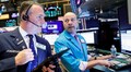 Global stocks hit record as rally enters new year, dollar rebounds