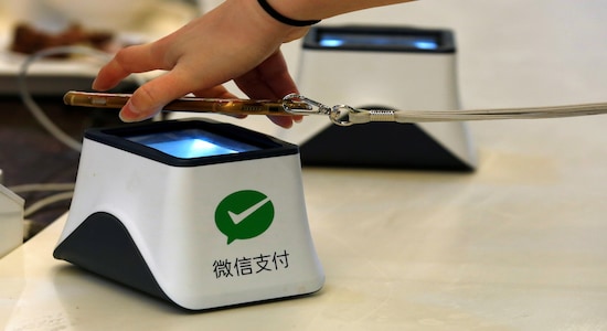 FILE PHOTO: A WeChat Pay system is demonstrated at a canteen as part of Tencent office inside TIT Creativity Industry Zone in Guangzhou, China May 9, 2017. REUTERS/Bobby Yip