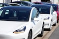 Elon Musk defies skeptics, meets Tesla delivery goal; shares hit record