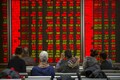 Global share sell-off pauses in Asia as investors await Fed policy update