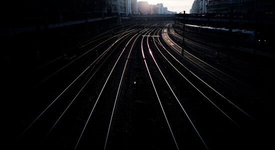 Light reflects from empty railway tracks outside the Saint Lazare train station in Paris on Tuesday, Dec. 31, 2019. The strikes over the French government's plan to revamp the retirement system have disrupted transport across France and beyond, hobbling Paris Metros and trains across the country as well as businesses. The strikes have been especially felt over the holiday season. (AP Photo/Kamil Zihnioglu)