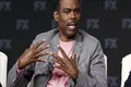 Chris Rock gets standing ovation at comedy show, says will talk about Oscars slap 'at some point'