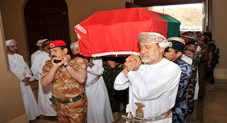In this photo made available by Oman News Agency, Oman's new sultan Haitham bin Tariq Al Said, right, carries the Sultan Qaboos' coffin at Sultan Qaboos Grand Mosque in Muscat, Oman, Saturday, Jan. 11, 2020. Sultan Qaboos bin Said, the Mideast's longest-ruling monarch who seized power in a 1970 palace coup and pulled his Arabian sultanate into modernity while carefully balancing diplomatic ties between adversaries Iran and the U.S., has died. He was 79. (Oman News Agency via AP)