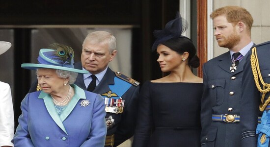 FILE - In this Tuesday, July 10, 2018 file photo Britain's Queen Elizabeth II, Prince Andrew, Meghan the Duchess of Sussex and Prince Harry stand on a balcony to watch a flypast of Royal Air Force aircraft pass over Buckingham Palace in London. As part of a surprise announcement distancing themselves from the British royal family, Prince Harry and his wife Meghan declared they will "work to become financially independent" _ a move that has not been clearly spelled out and could be fraught with obstacles. (AP Photo/Matt Dunham, File) FILE - In this Tuesday, July 10, 2018 file photo Britain's Queen Elizabeth II, Prince Andrew, Meghan the Duchess of Sussex and Prince Harry stand on a balcony to watch a flypast of Royal Air Force aircraft pass over Buckingham Palace in London. As part of a surprise announcement distancing themselves from the British royal family, Prince Harry and his wife Meghan declared they will "work to become financially independent" _ a move that has not been clearly spelled out and could be fraught with obstacles. (AP Photo/Matt Dunham, File)