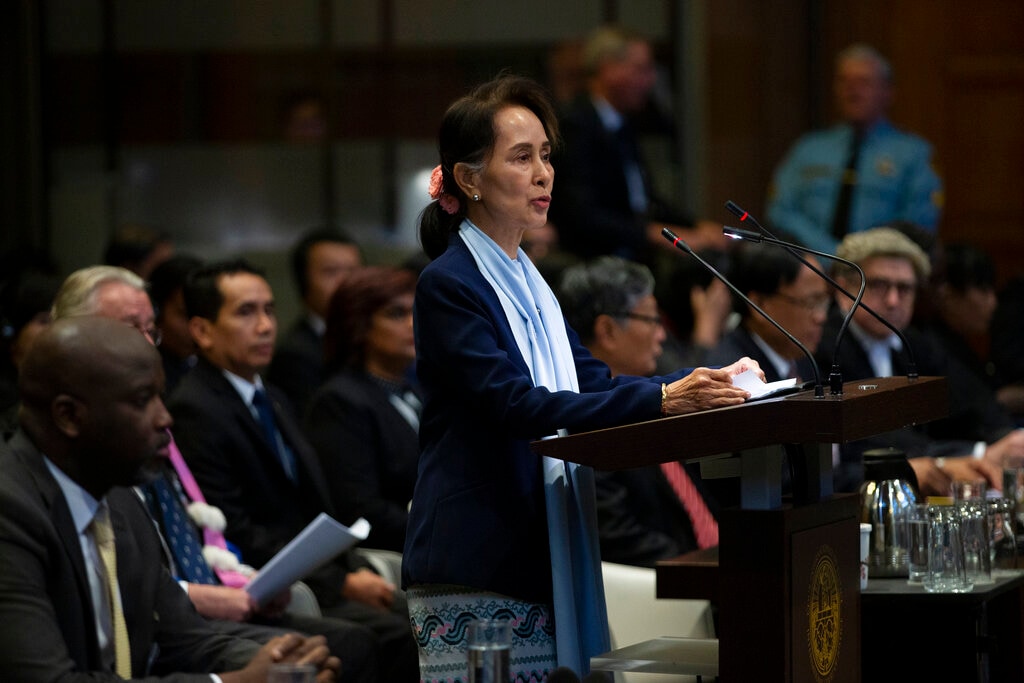 FILE - In this Dec. 11, 2019, file photo, Myanmar's leader Aung San Suu Kyi addresses judges of the International Court of Justice for the second day of three days of hearings in The Hague, Netherlands. The United Nations' highest court is set to rule Thursday, Jan. 23, 2020 on whether to order Myanmar to halt what has been described as a genocidal campaign against the country's Rohingya Muslim minority. The International Court of Justice decision comes in a case brought by the African nation of Gambia on behalf of an organization of Muslim nations that accuses Myanmar of genocide in its crackdown on the Rohingya. (AP Photo/Peter Dejong, File)