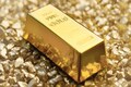Gold hovers near 2-week low on hopes of economic recovery