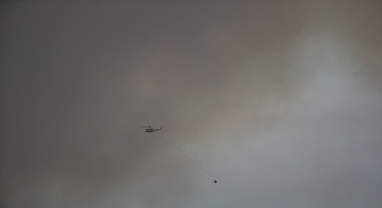 A helicopter carrying out aerial firefighting operations flies through the smoke of a bushfire in Bredbo, New South Wales, Australia, February 1, 2020. REUTERS/Loren Elliott A helicopter carrying out aerial firefighting operations flies through the smoke of a bushfire in Bredbo, New South Wales, Australia, February 1, 2020. REUTERS/Loren Elliott