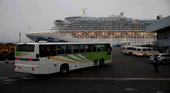 A bus arrives at the cruise ship Diamond Princess, where dozens of passengers were tested positive for coronavirus, at Daikoku Pier Cruise Terminal in Yokohama, south of Tokyo, Japan, February 16, 2020. REUTERS/Issei Kato