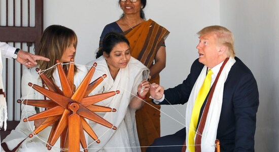 Donald Trump, Melania try spinning ''charkha'' at Sabarmati Ashram