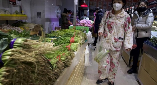 Chinese businesses guard against wave of infections feared after COVID easing