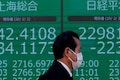 Asian shares dip, oil skids oan Shanghai shutdown