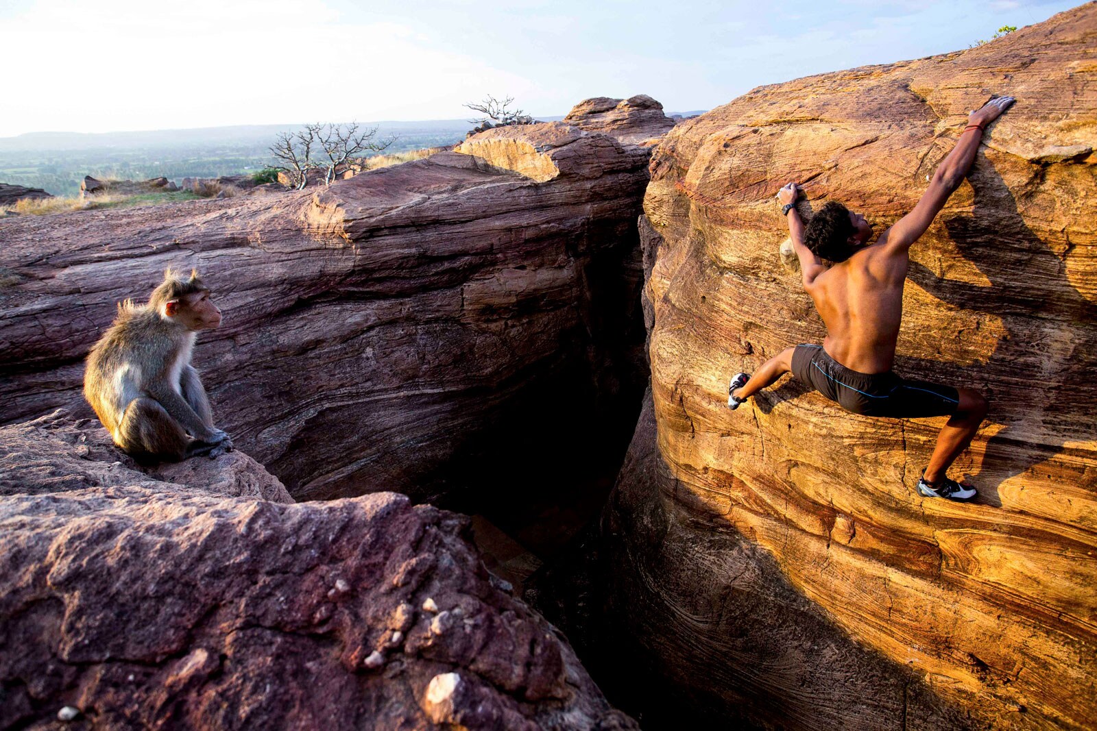 India's most decorated and accomplished climber, Praveen CM is seen bouldering in Badami, Karnataka. He holds the record of being the only man to successfully summit Mt Zambala, a treacherous mountain in Siachen Glacier.