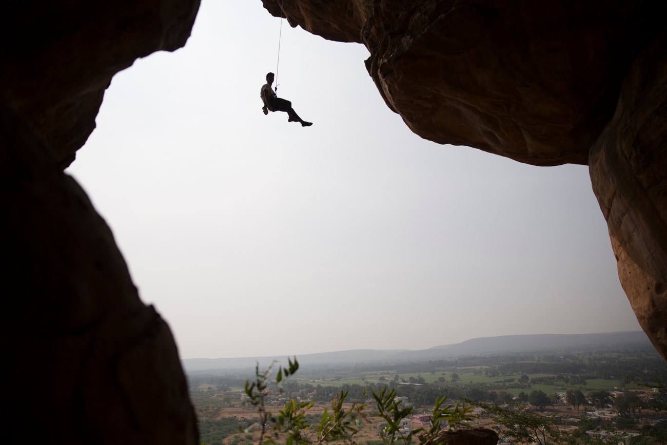 A climber seen at a famous climbing area in Badami, Karnataka.