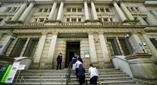 BOJ trims growth and price outlook, keeps policy steady
