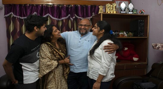 Three Indian photojournalists working with the Associated Press news agency -- Channi Anand, Dar Yasin and Mukhtar Khan -- have been awared the 2020 Pulitzer Prize, the most prestigious prize in journalism globally, in the feature category. They won the prize for the coverage of the lockdown that was implemented after Article 370 was revoked in the state on August 5, 2019. (Above) AP photographer Channi Anand celebrates with his family following the announcement that he was one of three AP photographers who won the Pulitzer Prize. (AP Photo) Three Indian photojournalists working with the Associated Press news agency -- Channi Anand, Dar Yasin and Mukhtar Khan -- have been awared the 2020 Pulitzer Prize, the most prestigious prize in journalism globally, in the feature category. They won the prize for the coverage of the lockdown that was implemented after Article 370 was revoked in the state on August 5, 2019. (Above) AP photographer Channi Anand celebrates with his family following the announcement that he was one of three AP photographers who won the Pulitzer Prize. (AP Photo)