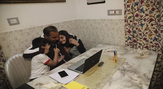 Check out the pictures from their award winning coverage below. (Above) AP photographer Mukhtar Khan hugs his children at his home in Srinagar following the announcement (AP Photo/Afnan Arif)