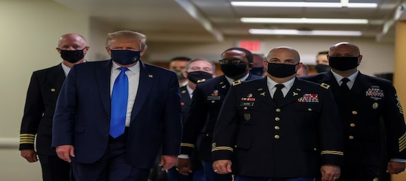 In a first, Trump dons masks in visit to a military medical facility