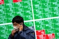Asian shares sink as China says Q1 growth at 4.8%