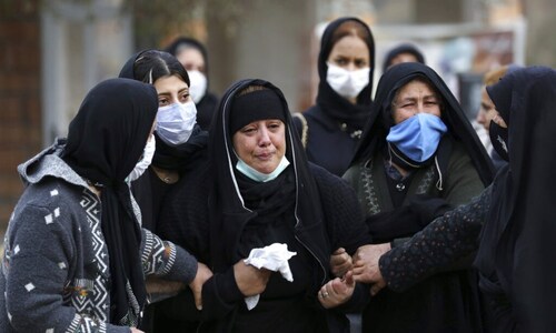 In pictures: Iran struggles to bury virus victims