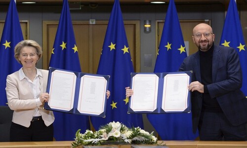 EU officials formally sign post-Brexit trade deal with UK