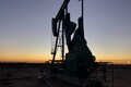 Oil prices up as dollar and U.S. oil inventories fall