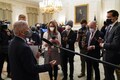Testing wristbands, masks a sign of new boss at White House