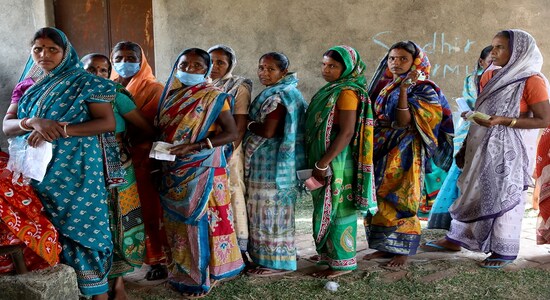 FILE: Women wait in line to cast their vote at a polling station during the first phase of West Bengal state election. REUTERS/Rupak De Chowdhuri