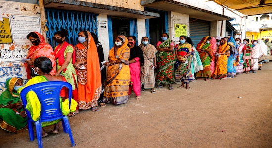 FILE: Voters stand in a queue to cast their votes outside a polling booth during first phase of elections in West Bengal state (AP Photo/Bikas Das)