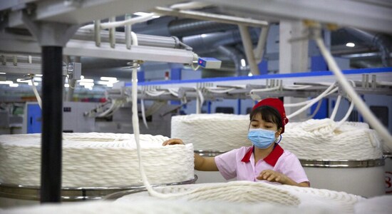 In pics: Factory boss defiant as sanctions bite in China's Xinjiang